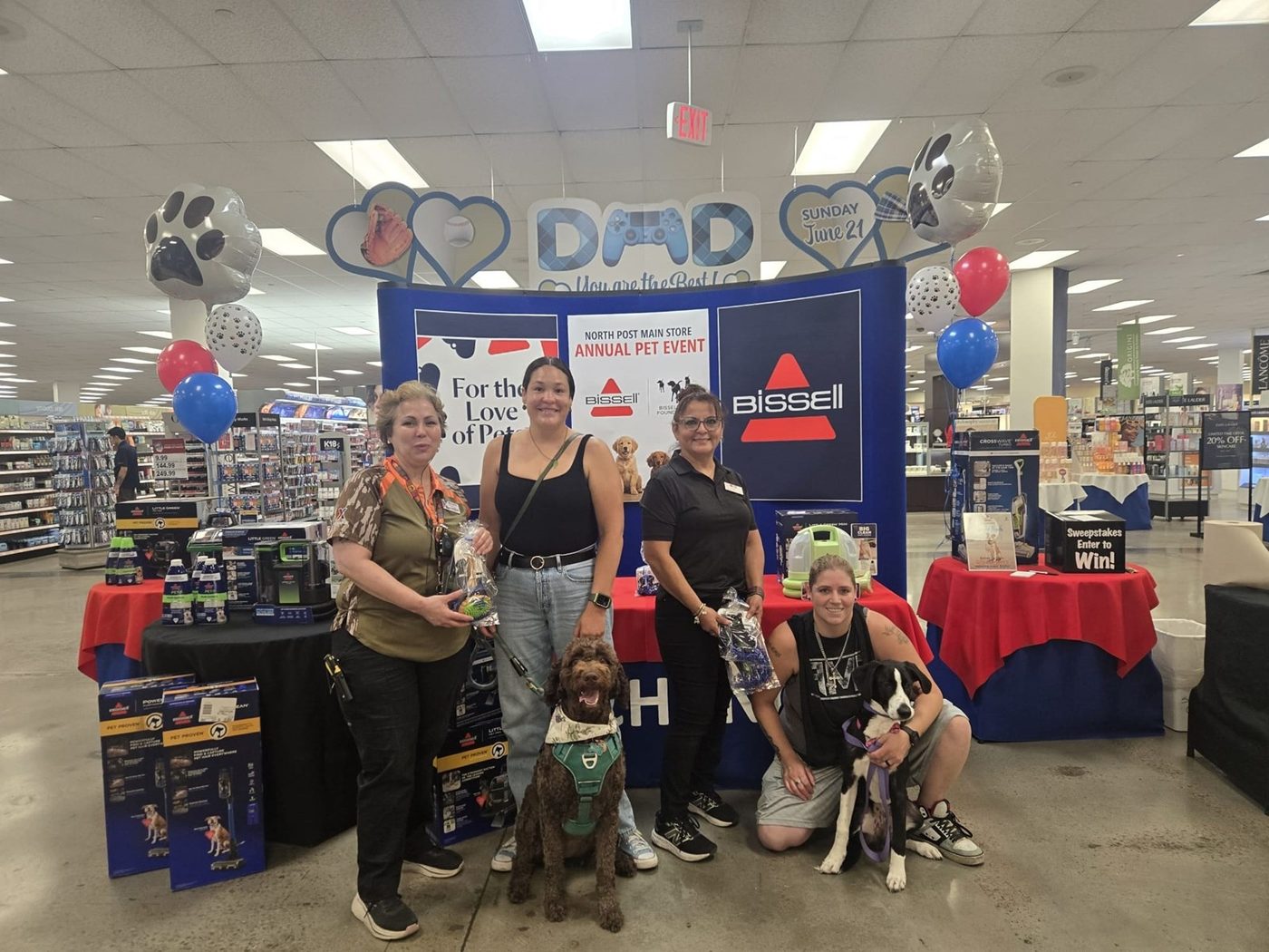 Bissell annual pet event with MSS associates and dogs at a Father's Day display in an exchange