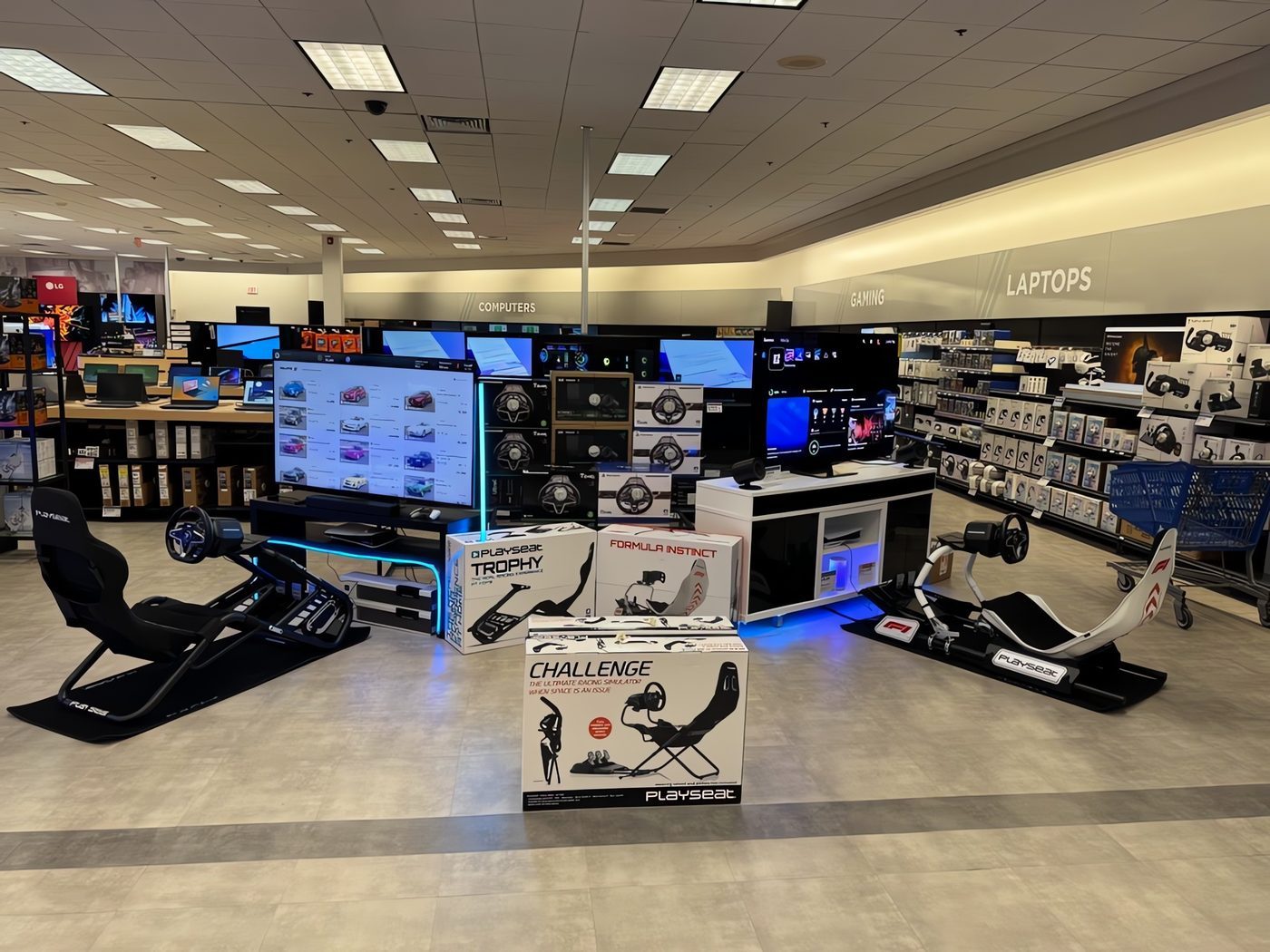 Playseat racing simulator and gaming display in the electronics department